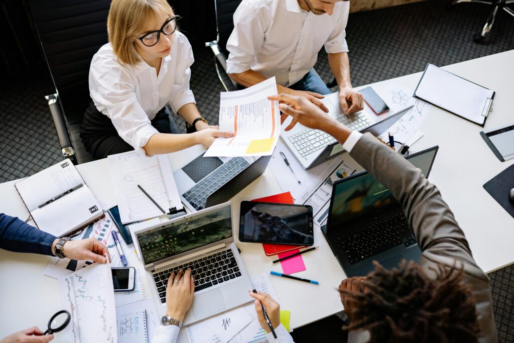 Pharma scientific content team scaling one narrative across multiple formats and channels in a collaborative production meeting